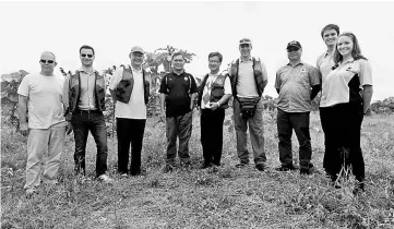  ??  ?? Ambassador Yun (centre) and Pang (third from left), Jimli (third from right), Dr Benoit (fourth from right), Rosli (fourth from left), DGFC students Luke Evans and Meg Harris (right), and US Embassy members Frank Whitaker (first from left) and Alex...