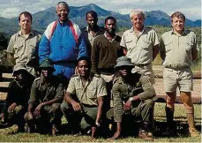  ??  ?? Peter (second from right) with his team and the late President Nelson Mandela.