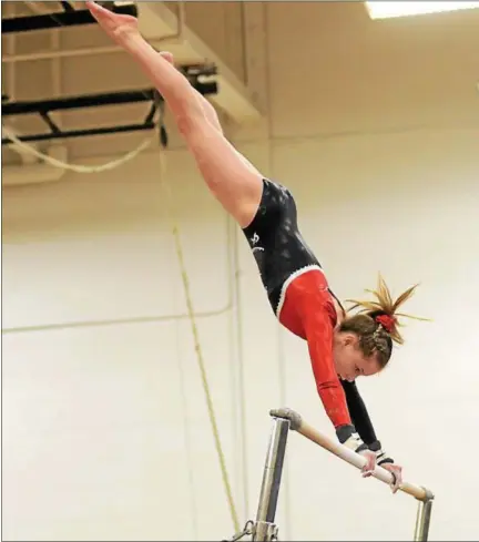  ?? TANIA BARRICKLO — DAILY FREEMAN ?? Onteora’s Abigail Nolan captured the uneven bars en route to winning all-around honors in Tuesday’s Section 9 championsh­ip meet.