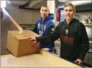  ?? PHOTO PROVIDED ?? Joseph Ferro and Kobe Ferro, SkillsUSA members and Ulster BOCES Ciscostude­nts from the Kingston school district, help unload goods at the St. JamesHappy to Help Food Pantry in Kingston, N.Y.