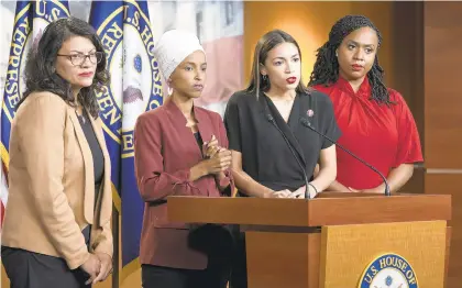  ?? J. SCOTT APPLEWHITE/AP ?? Members of the “Squad” — Rep. Rashida Tlaib, D-Mich., from left, Rep. Ilhan Omar, D-Minn., Rep. Alexandria Ocasio-Cortez, D-N.Y., and Rep. Ayanna Pressley, D-Mass., respond to remarks by President Donald Trump during a news conference in July.