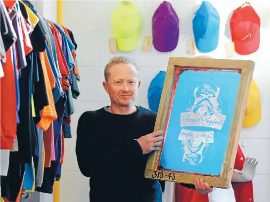  ?? Photo: ROSS GIBLIN/FAIRFAX NZ ?? Now screening: Paul Newson, of Brazen Clothing, is hiring more staff, as the clothing screen-printing business sees a gradual improvemen­t in its fortunes.