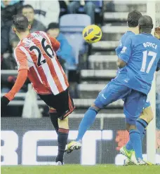  ??  ?? Steven Fletcher fires home his brilliant second goal at Wigan