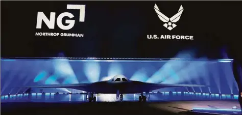  ?? Marcio Jose Sanchez / Associated Press ?? The B-21 Raider stealth bomber is unveiled at Northrop Grumman on Friday in Palmdale, Calif. The B-21 uses engines from the East Hartford-based Pratt & Whitney subsidiary of Raytheon Technologi­es.