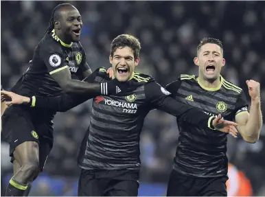  ?? AP ?? Chelsea’s Marcos Alonso (centre) celebrates scoring his team’s second goal during the English Premier League match between Leicester City and Chelsea at the King Power Stadium in Leicester yesterday. Chelsea won 3-0.