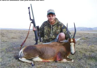  ??  ?? Dandrej Barnard poses with a blesbuck ewe taken on the Mpumalanga Highveld with a .30-06. The extendable bipod is folded up and out of the way for carrying.