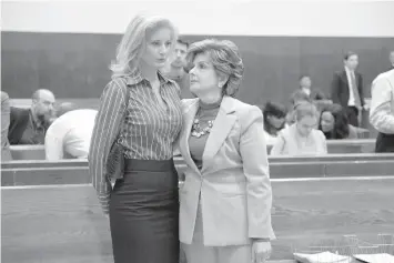  ?? AGENCE FRANCE PRESSE ?? Summer Zervos (left), a former contestant on the television show “The Apprentice,” listens to her lawyer Gloria Allred in New York County Criminal Court, in New York, during a hearing on the defamation lawsuit againt US President Donald Trump.