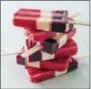  ?? CARL TREMBLAY — AMERICA’S TEST
KITCHEN VIA AP ?? This undated photo provided by America’s Test Kitchen in July 2018shows striped fruit popsicles in Brookline, Mass. This recipe appears in the cookbook “Naturally Sweet.”