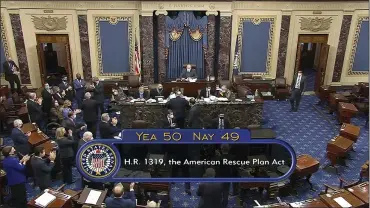  ?? SENATE TELEVISION VIA ASSOCIATED PRESS ?? In this image from video, the vote total of 50-49on Senate passage of the COVID-19relief bill, is displayed on screen in the Senate at the U.S. Capitol in Washington, Saturday.