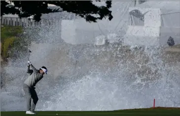  ?? PHOTOS BY GODOFREDO A. VÁSQUEZ — THE ASSOCIATED PRESS ?? Keith Mitchell prepares to hit a shot from the 18th fairway of the Pebble Beach Golf Links during the fourth round of the AT&T Pebble Beach Pro-Am Monday.