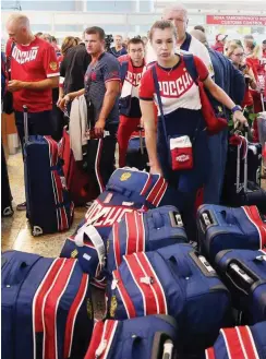  ?? Foto: imago/ITAR-TASS ?? Russische Sportler machen sich auf den Weg zu den Olympische­n Spielen nach Rio. Manch einer könnte schon bald die Landesfarb­e wechseln.