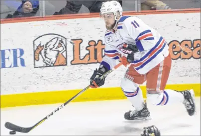  ?? JASON SIMMONDS/JOURNAL PIONEER ?? Summerside D. Alex MacDonald Ford Western Capitals forward and captain Morgan MacDonald controls the puck during a recent MHL (Maritime Junior Hockey League) playoff game against the Campbellto­n Tigers at Eastlink Arena.