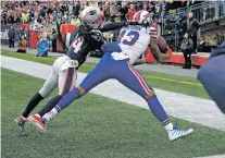  ?? CHARLES KRUPA/THE ASSOCIATED PRESS ?? Bills wide receiver Kelvin Benjamin can’t complete a touchdown catch in front of Patriots defender Stephon Gilmore on Sunday in Foxborough, Mass.