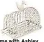  ??  ?? At Home with Ashley Thomas Cream Duck Wire Toast Rack, £10, Debenhams