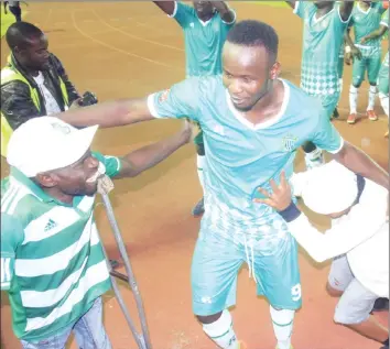  ??  ?? HAPPY PEOPLE ... CAPS United goalscorer Dominic Chungwa celebrates with the club’s fans after his goal powered the Green Machine to victory last night