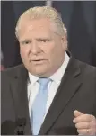  ?? The Canadian Press ?? Ontario Premier Doug Ford answers hard questions from the Toronto media,Tuesday.