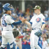  ?? CASSELLA/CHICAGO TRIBUNE BRIAN ?? Cubs reliever Keegan Thompson celebrates a win against Arizona with catcher P.J. Higgins on May 22.