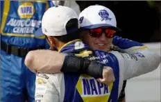  ?? Jared C. Tilton/Getty Images ?? Bill Elliott embraces his son in Victory Lane at Road America earlier this season. Saturday night, they’ll race each other.
