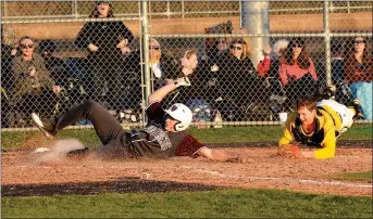  ?? Mike Capshaw/Herald-Leader ?? Siloam Springs’ Jacob Rowe slides in ahead of the tag by Prairie Grove catcher Couper Allen during the third inning of the Panthers’ 13-2 win at Prairie Grove on Monday.