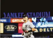  ?? Elsa / Getty Images ?? The Yankees’ Aaron Judge runs to the dugout after the fifth inning against the Houston Astros in Game 4 of the American League Championsh­ip Series at Yankee Stadium on Sunday.