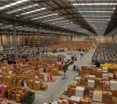  ?? ANDREW YATES/AFP/GETTY IMAGES ?? Working in Amazon “fulfilment centres” is famously arduous; every object/human is tracked for location and rated for speed, so it would seem only the cleverest of employees could steal successful­ly, writes Heather Mallick.