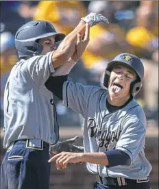  ??  ?? Ringgold’s Luke Winterbott­om high fives teammate Koby Bubash after a run against Valley View in the PIAA Class 4A baseball championsh­ip. Ringgold beat Valley View, 6-4.