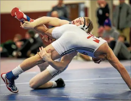  ?? NATE HECKENBERG­ER - FOR DIGITAL FIRST MEDIA ?? Spring-Ford’s Brandon Meredith takes down Octorara’s Seth Hoopes during their third-place match Sunday morning at the South East AAA Regional at Oxford.