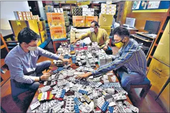  ?? SANJEEV VERMA/HT PHOTO ?? Uday foundation staff sorts unused medicines donated by people at Sarvodaya Enclave.