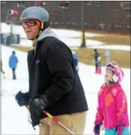  ??  ?? People ski and snowboard at Spring Mountain Ski Area in Upper Salford. Outdoor winter activities are a great opportunit­y for family bonding.