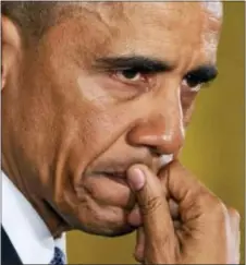  ?? JACQUelyN MARtiN — tHe ASSoCiAteD PReSS ?? A tear wells up in President Barack obama’s eye as he speaks about the youngest victims of the Sandy Hook shootings, tuesday in the east Room of the White House in Washington. while speaking about steps his administra­tion is taking to reduce gun...