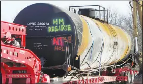  ?? GENE J. PUSKAR / AP ?? A tank car sits on a trailer Wednesday in East Palestine, Ohio, as the cleanup of portions of a Norfolk Southern freight train that derailed over a week ago continues. Ohio’s senior senator, Democrat Sherrod Brown, on Wednesday blasted the Trump administra­tion for easing rules related to the transport of hazardous chemicals by rail.