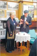  ??  ?? Kathryn Jensen and Scott Bond light a candle for the third decade.