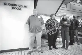  ?? NWA Democrat-Gazette/DAVID GOTTSCHALK ?? Don Rosenbaum (left) of Goshen is the first in line Monday to enter the Quorum Court Room to vote at the Washington County Courthouse in Fayettevil­le.