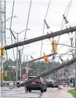  ?? ?? Downed utility poles are seen in Ottawa, where more than 170,000 customers were still without power Sunday. In Toronto, 7,600 homes remained without power.