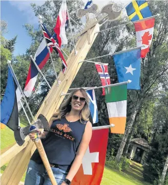  ??  ?? Suzy Powley-Atwood at world championsh­ip axe-throwing competitio­n. The Barrington woman has competed at the internatio­nal level multiple times. SUBMITTED PHOTO