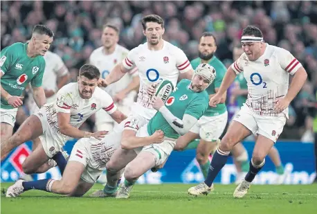  ?? ?? Ireland's Mackenzie Hansen is tackled during the Guinness Six Nations match at Aviva Stadium against England.