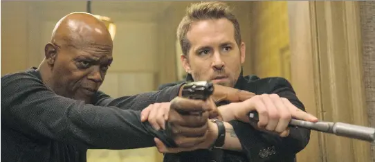  ?? JACK ENGLISH/LIONSGATE VIA AP ?? The Hitman’s Bodyguard from Lions Gate Entertainm­ent Corp., starring Samuel L. Jackson, left, and Ryan Reynolds, led the U.S. box office for a third time, generating US$13.4 million through Monday. The holiday weekend generated about US$99.5 million in...