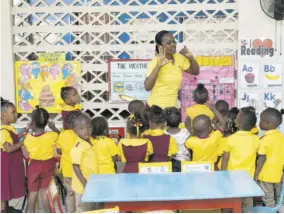  ?? ?? All eyes are trained on Riverton Meadows Early Childhood Centre K-1 teacher Doneva Martin as she teaches her young students the basics of counting.