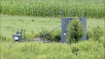  ?? Darrell Sapp/Post-Gazette ?? A view of the Margaret Hamilton 4 Well near a field of corn this summer in Plum.