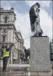  ?? PICTURE: GETTY IMAGES. ?? CONTROVERS­Y: A worker cleans the defaced Churchill statue in Parliament Square.