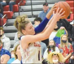  ?? RICK PECK/ SPECIAL TO MCDONALD COUNTY PRESS ?? McDonald County’s Caitlyn Barton grabs a rebound during the Lady Mustangs’ 70-31 win over Springfiel­d Hillcrest on Jan. 4 at MCHS.
