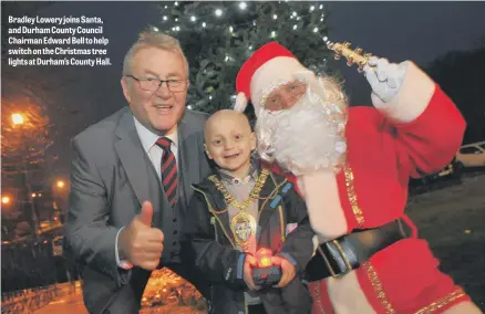 ??  ?? Bradley Lowery joins Santa, and Durham County Council Chairman Edward Bell to help switch on the Christmas tree lights at Durham’s County Hall.
