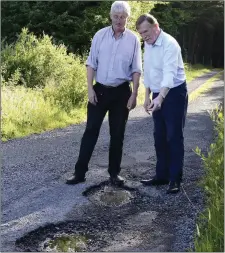  ?? Pic: ?? Largan resident Michael Carney and Cllr Jerry Lundy view damaged roads in the Largan area. Tom Callanan.