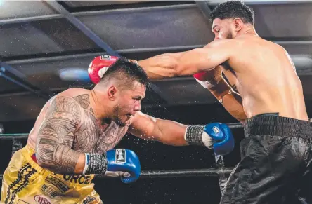  ?? Picture: KEVIN FARMER ?? CHINA BOUND: Toowoomba's Herman Ene-Purcell ducks under a Will Nasio's shot as they battle for the Australasi­an heavyweigh­t title at Rumours Internatio­nal in July