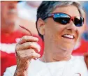  ?? [PHOTO BY NATE BILLINGS, THE OKLAHOMAN] ?? OU fans like Vicki Eifel have been twirling rally Twizzlers since last season.