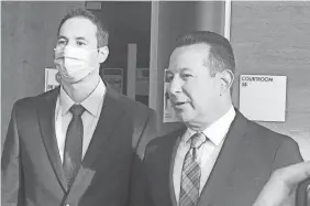  ?? JOHN FUTTY/COLUMBUS DISPATCH ?? Defense attorney Jose Baez, right, stands beside his client, Dr. William Husel, as he speaks to reporters Wednesday outside a Franklin County Common Pleas courtroom.