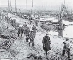  ?? COPIES OF PICTURE AVAILABLE FROM ODT FRONT OFFICE, LOWER STUART ST, OR WWW.OTAGOIMAGE­S.CO.NZ ?? The devastated battlefiel­d on the Western Front: Troops at the Somme relieved from duty. — Otago Witness, 14.2.1917.