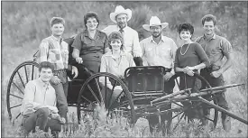  ?? Courtesy Donnis Hueftle-Bullock ?? The Hueftle family is shown above with the family buggy in 1986.