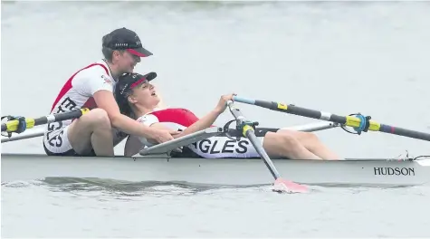  ?? JULIE JOCSAK/STANDARD STAFF ?? Hailey Mercuri and Isabelle Frolick of Grimsby Secondary School hug after winning the junior women double during the Canadian high school rowing championsh­ips at Henley Island in St. Catharines on Sunday.