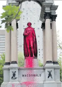  ?? ALLEN McINNIS ?? The group claiming responsibi­lity for defacing the Sir John A. Macdonald monument at Place du Canada says the act was in support of the city of Victoria’s removal of its own Macdonald monument.